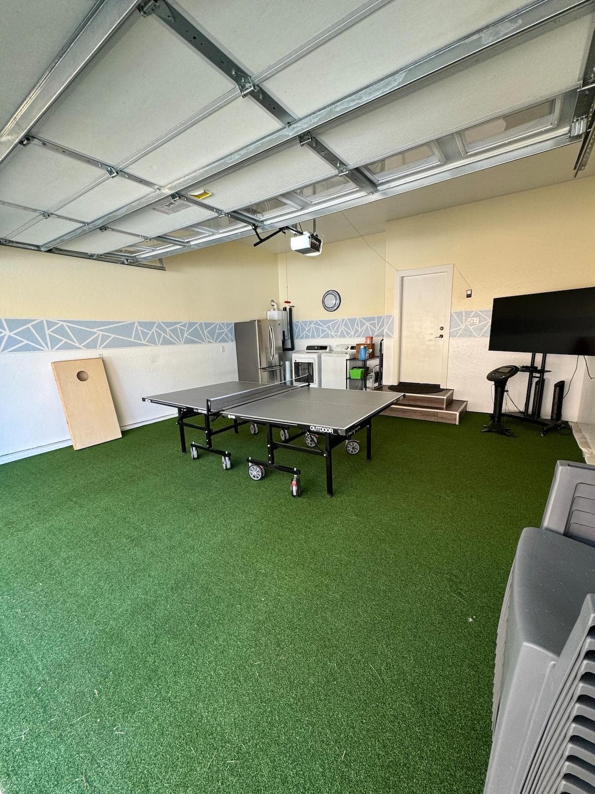 Ping pong table and karaoke machine to play on 65inch tv. Full size washer and dryer with full size refrigerator in garage. 